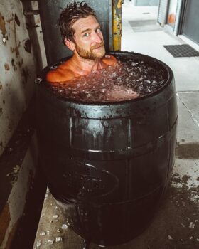 Influencer Eric Hinman takes ice bath in an Ice Barrel