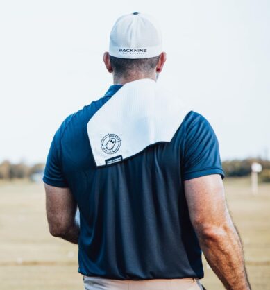 Influencer post of golfer with the Ghost Golf magnetic golf towel thrown over his shoulder