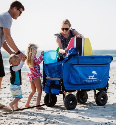 Family influencers showcase the convenience of the Lounge Wagon utility wagon on a beach with their children