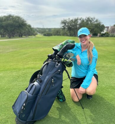 Influencer poses on the golf course with her Vessel Golf bag