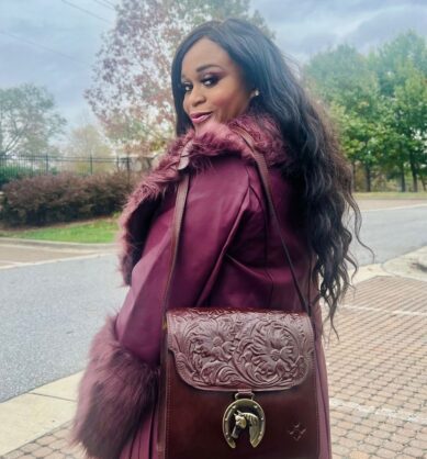 Influencer posing with Patricia Nash Nazaire Crossbody with Horse Charm