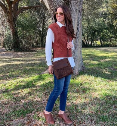 Influencer posing with Patricia Nash brown suede bag