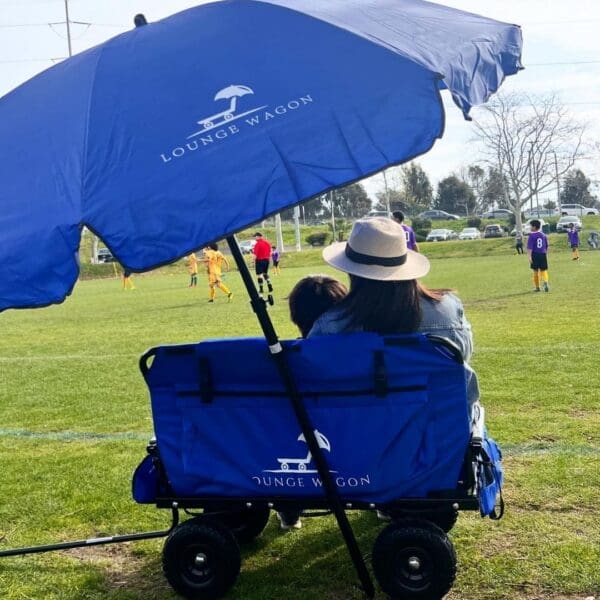 mom at ball field using lounge wagon
