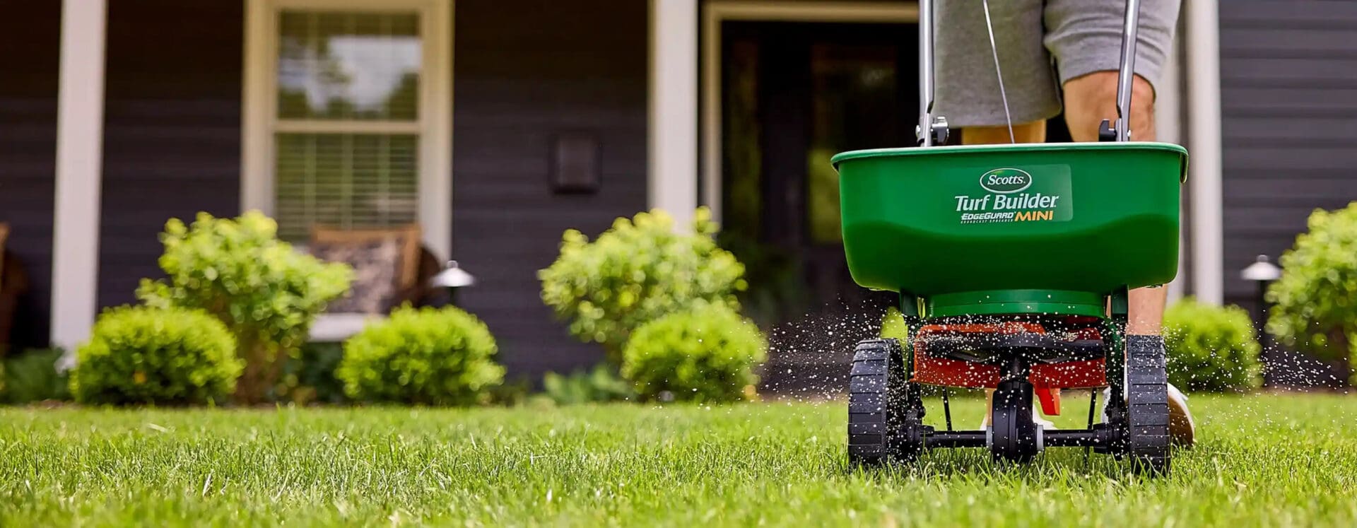 Scotts spreader in front of house